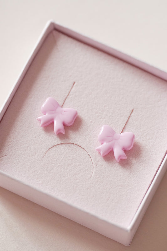 Puces d'oreilles noeuds rose