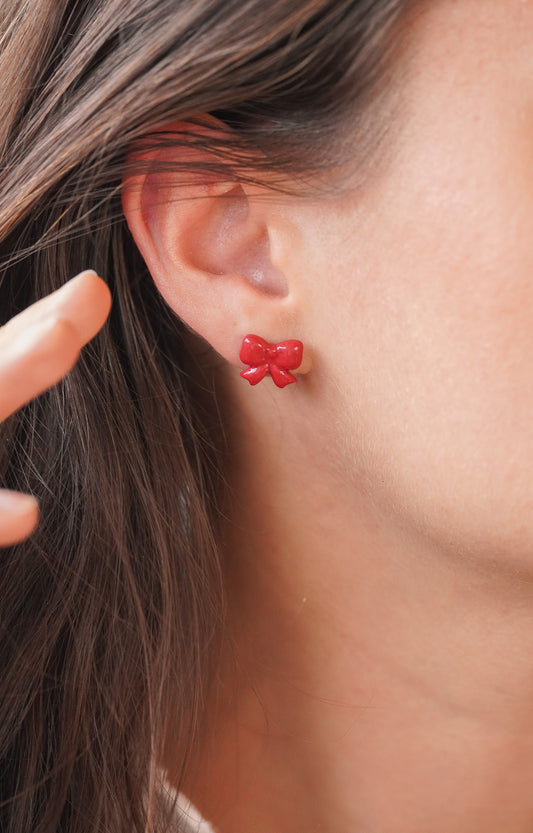 Puces d'oreilles noeuds rouge